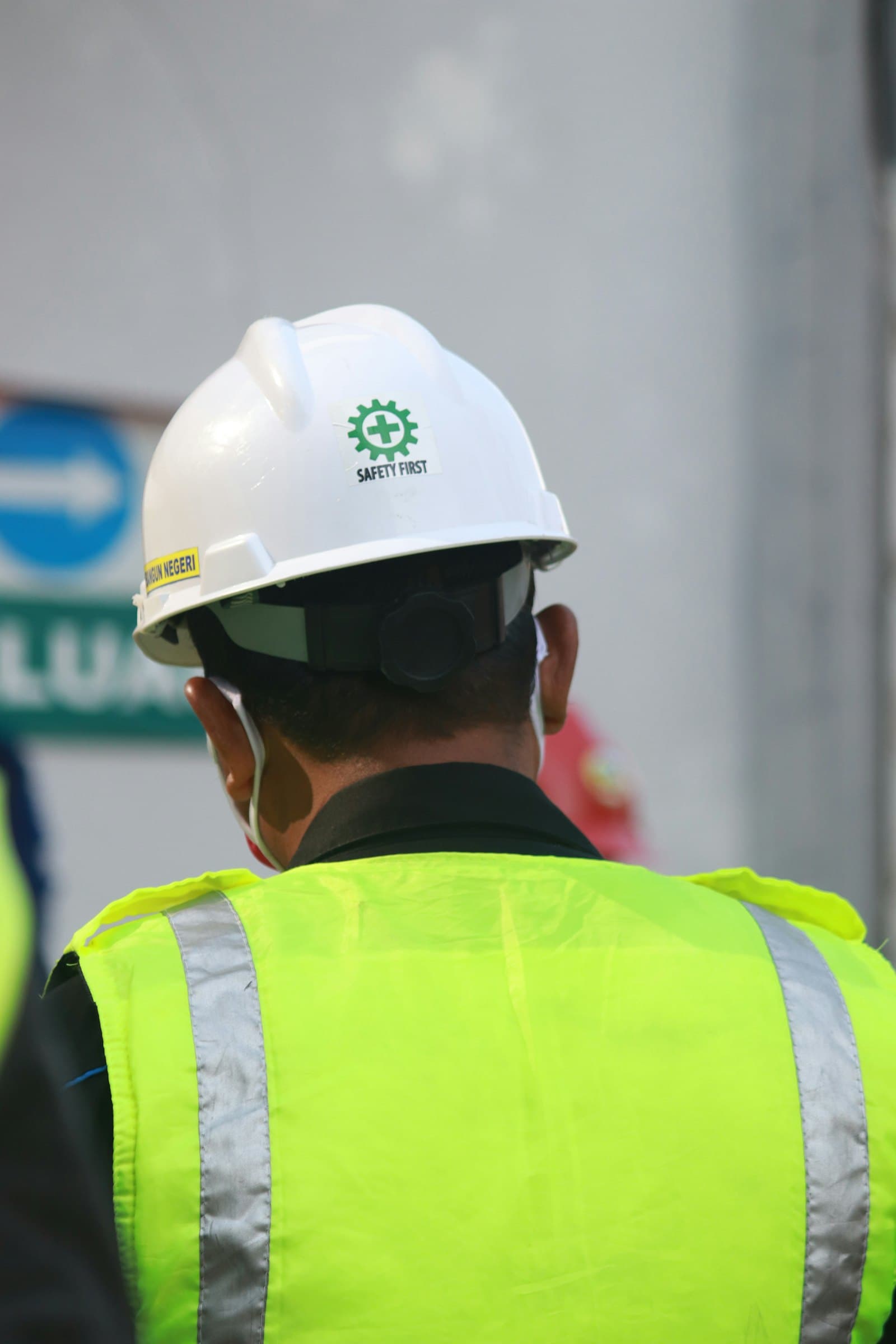 Site personnel in high-visibility safety equipment